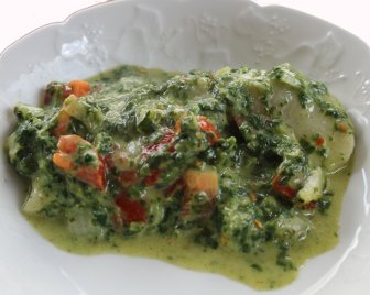 Pangasiusfilet auf Tomaten-Spinat Portion